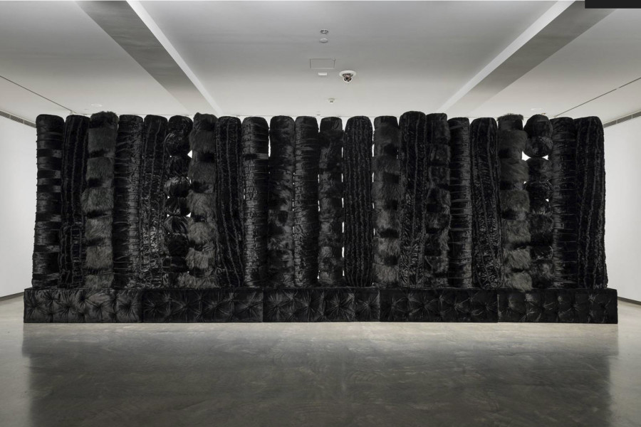 Installation view, Kathy Temin The Memorial Project: Black Wall (section 2), 2015, wood, steel, synthetic fur and filling, 240 x 800 x 40; Image courtesy of the Museum of Contemporary Art Australia