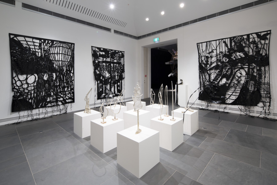 Caroline Rothwell Climatic, 2014, Britannia metal, PVC, stainless steel, dimensions variable; Exhibition view, Adelaide Biennial of Australian Art: Dark Heart (1 March – 11 May 2014)