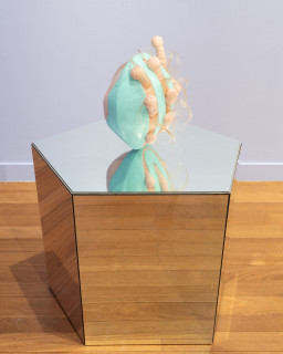 Patricia Piccinini Egg Head in Motion, 2025; silicone, polyurethane, hair, stainless steel, microcontroller, motor, mirrored plinth; 95 x 50 x 61 cm; From a suite of 3 colour variations; enquire