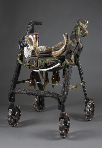 Fiona Hall Wounded Walking, 2016; walker, tjanpi grass, camoflage fabric, aluminium cans, glass, wire; 94 x 60 x 62 cm; Enquire