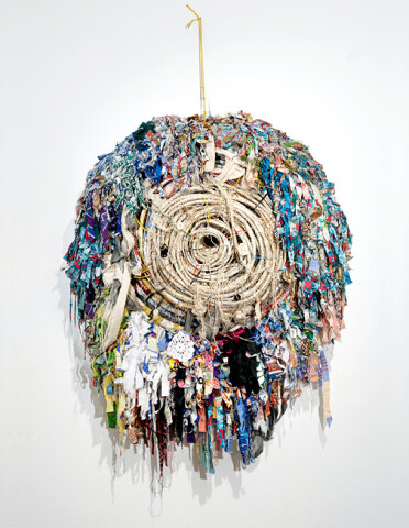 Newell Harry Voodoo Ray (from 'A Guy Called Gerald' 1988), 2008; string, jute twine, garden hose, cable, cable ties, insulation tape, enamel, Ngunese doormats (Pacific calico + rice sacking), miniature doilies (Preeti Lieberman); 90 x 115 x 27 cm; enquire