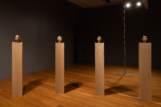 installation view; Julie Rrap Brazen Heads, 2026; bronze, wood; 12 parts; 161 x 24 x 24 cm each, dimensions variable based on installation configuration; Edition of 2 + 1 AP; enquire