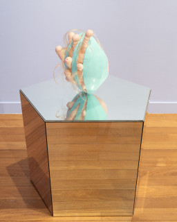 Patricia Piccinini Egg Head in Motion, 2025; silicone, polyurethane, hair, stainless steel, microcontroller, motor, mirrored plinth; 95 x 50 x 61 cm; From a suite of 3 colour variations; enquire