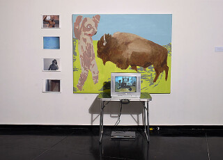 A Constructed World Bull & Bear, 2004; acrylic on canvas, 122x152cm, 4 ink jet prints on photographic paper 21x 29.7, ‘animal 3’ dvd 4’, monitor, dvd player, picnic table; enquire
