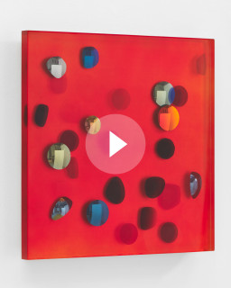 Jim Lambie July 2002, Coral red unveils across a silken sky, 2026; resin, sunglasses lens, birch plywood, paint; 51 x 51 x 5 cm; enquire