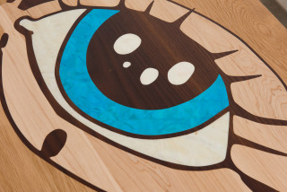 Del Kathryn Barton eye bench (detail), 2022; American White Oak with Cambia Ash and Rock Maple inlay, Abalone Green, Red, Blue and White Fresh Water mother of pearl inlay, brass, ink and watercolour on paper; 45 x 240 x 50 cm; 40kg; enquire