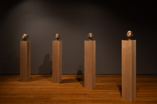 installation view; Julie Rrap Brazen Heads, 2026; bronze, wood; 12 parts; 161 x 24 x 24 cm each, dimensions variable based on installation configuration; Edition of 2 + 1 AP; enquire
