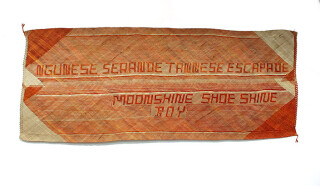 Newell Harry untitled (Ngunese Serenade Tannese Escapade/ Moonshine Shoe Shine/ Boy), 2011; from the series gift mat; Pandanus, dye; 102 x 247 cm; enquire