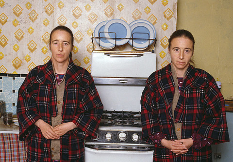 Juliet Darling A Pair of One, Greta and Freda in kitchen with stove, 2009; hand printed colour Ilfochrome print from transparency; 56 x 75 cm; Edition of 5 + AP 2; enquire