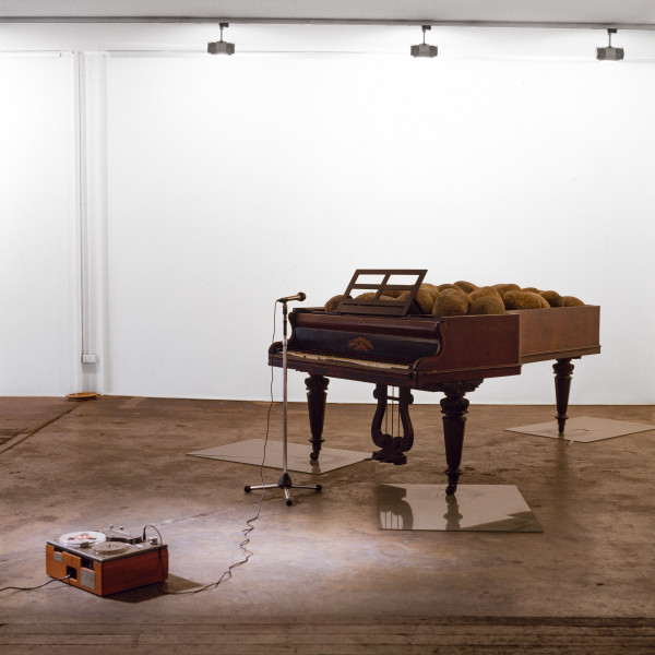 Ken Unsworth, Shatter Me Music......Rilke, 1987; grand piano, river stones, glass sheets with images, microphone and stand, reel to reel tape recorder; dimensions variable