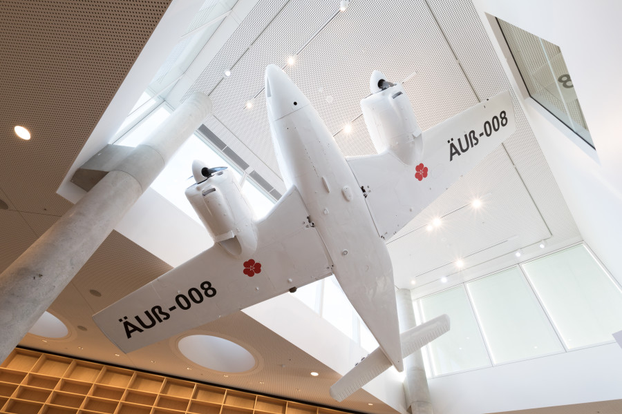 Claire Healy and Sean Cordeiro Cloud Nation 2018, Beechcraft travelair, HO scaled diorama elements, stainless steel monoculars; Installation view, Green Square Library, Sydney; Photo: Silversalt Photography