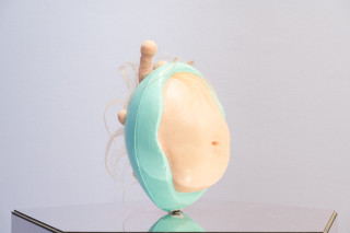 Patricia Piccinini Egg Head in Motion, 2025; silicone, polyurethane, hair, stainless steel, microcontroller, motor, mirrored plinth; 95 x 50 x 61 cm; From a suite of 3 colour variations; enquire