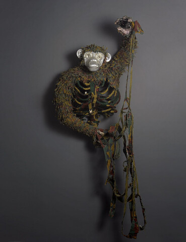 Fiona Hall Pan troglodytes / chimpanzee, Equatorial Africa, 2012; IUCN threat status: endangered
Belgium military camouflage jacket (also worn in the Belgian Congo, 'jigsaw' pattern), aluminium, leather gloves, theeth, medical model heart, plastic toy, mobile phone, nails, bottle caps; 180 x 78 x 35 cm; enquire