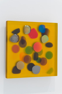 Jim Lambie April 1984, Sunlight Bathed In Golden Glow, 2026; resin, sunglasses lens, birch plywood, paint; 33 x 33 x 5 cm; enquire