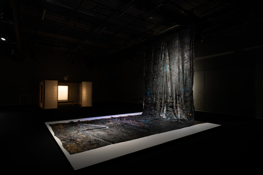 Kirtika Kain Midnight, 2025; tar on hessian, stones, gold leaf and acrylic paint; 885 x 329 cm; dimensions variable; more info; enquire