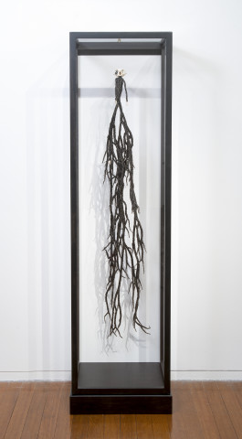 Fiona Hall Monkey Magic, 2012; glass beads, wire, monkey skull, dice, vitrine; 148 x 32 x 17 cm; enquire