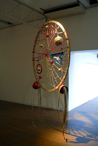 Rohan Wealleans Red Spirit Snare, 2006; an intricate system of wood, string, rope, ceramic beads, fish buoys, baby rattles and paint with steel stand; 294 x 226.5 x 280 cm; enquire