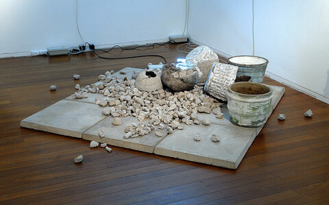 Newell Harry Ovid/Void: Rousing the Rubble (for David), 2008; pulped newspaper, found vessels, concrete pavers, neon, photograph (portrait of the artist?s mother South Africa, circa 1968); dimensions variable; enquire