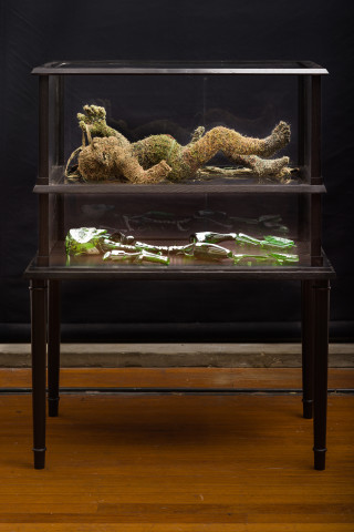 Fiona Hall stone thrower, 2020; millitary fabric, oil paint on glass, vitrine; 136 x 107 x 65 cm; enquire
