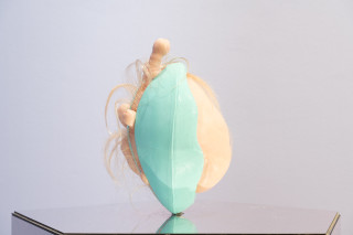 Patricia Piccinini Egg Head in Motion, 2025; silicone, polyurethane, hair, stainless steel, microcontroller, motor, mirrored plinth; 95 x 50 x 61 cm; From a suite of 3 colour variations; enquire
