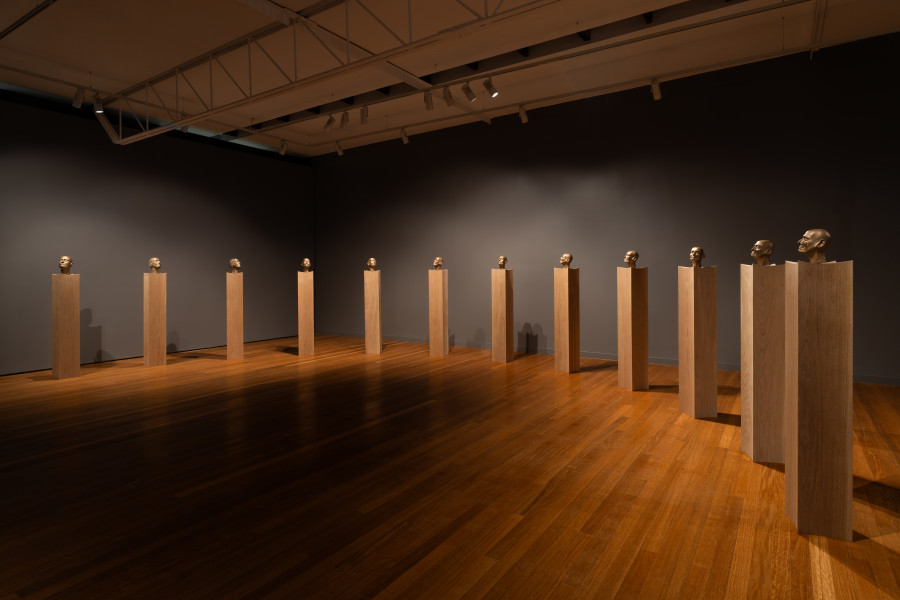 Julie Rrap Brazen Heads, 2026; bronze, wood; 12 parts; 161 x 24 x 24 cm each, dimensions variable based on installation configuration; Edition of 2 + 1 AP; enquire