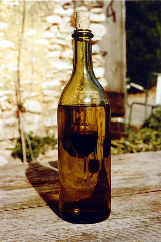 Bill Culbert Bouteille blanche, verre rouge/white bottle, red glass, 1992; colour photograph; 31 x 27 cm; Edition of 20; enquire