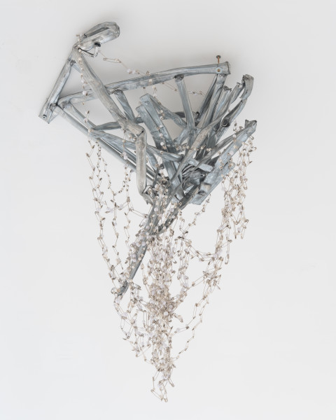 Jim Lambie Crushed Barrier (Everlasting Blanket of Stars), 2026; crushed metal barrier, safety pins, pearlescent beads; 120 x 60 x 70 cm; enquire
